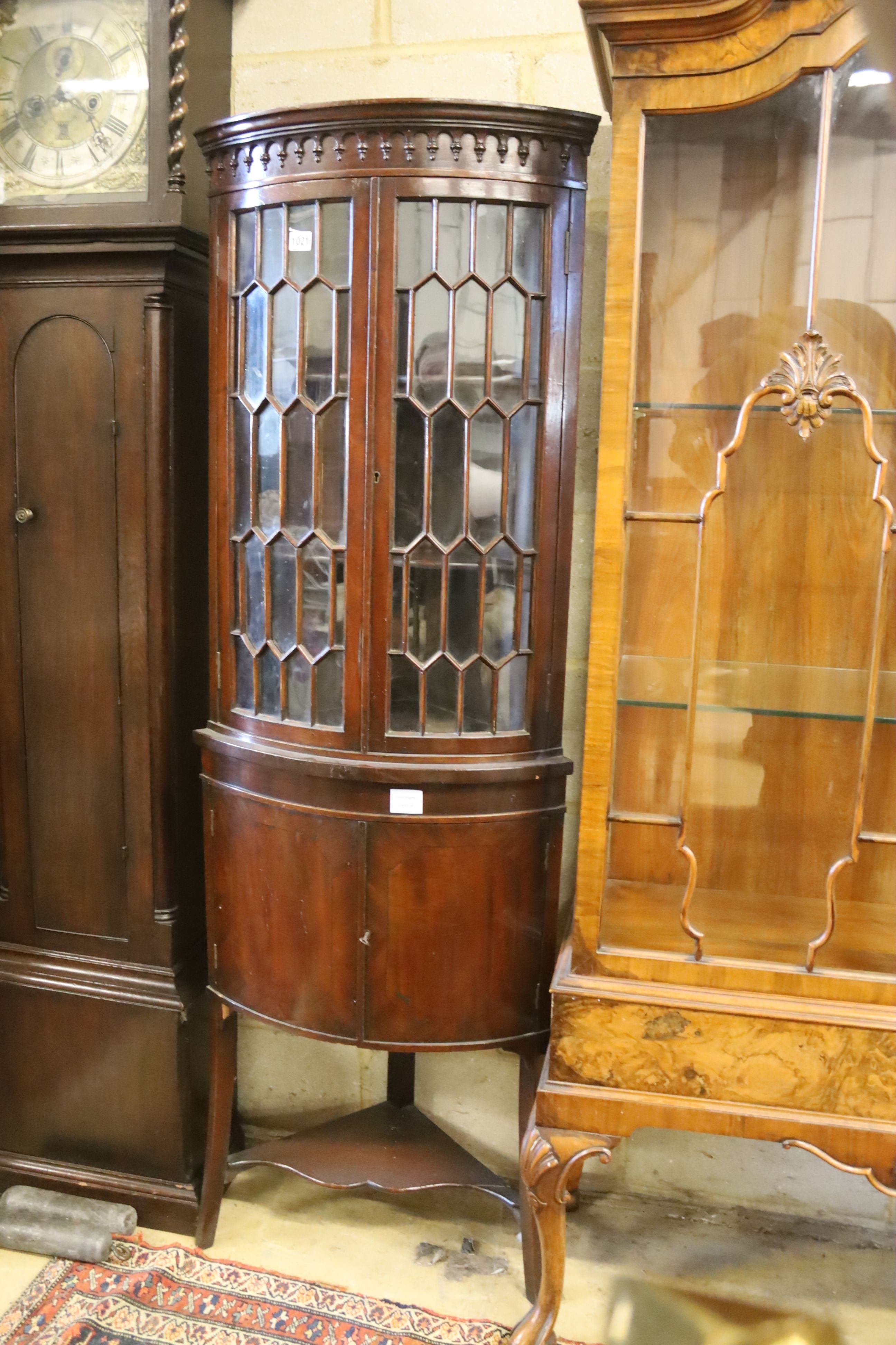 An Edwardian banded mahogany bow fronted standing corner cabinet, width 52cm, depth 38cm, height 165cm